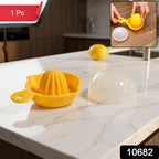 Disassembled components of citrus juicer showing reamer and filter