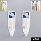 Various household items like keys and towels hanging from strong self-adhesive wall hooks.