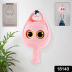 Close-up of the charming cat-shaped adhesive coat hook design.