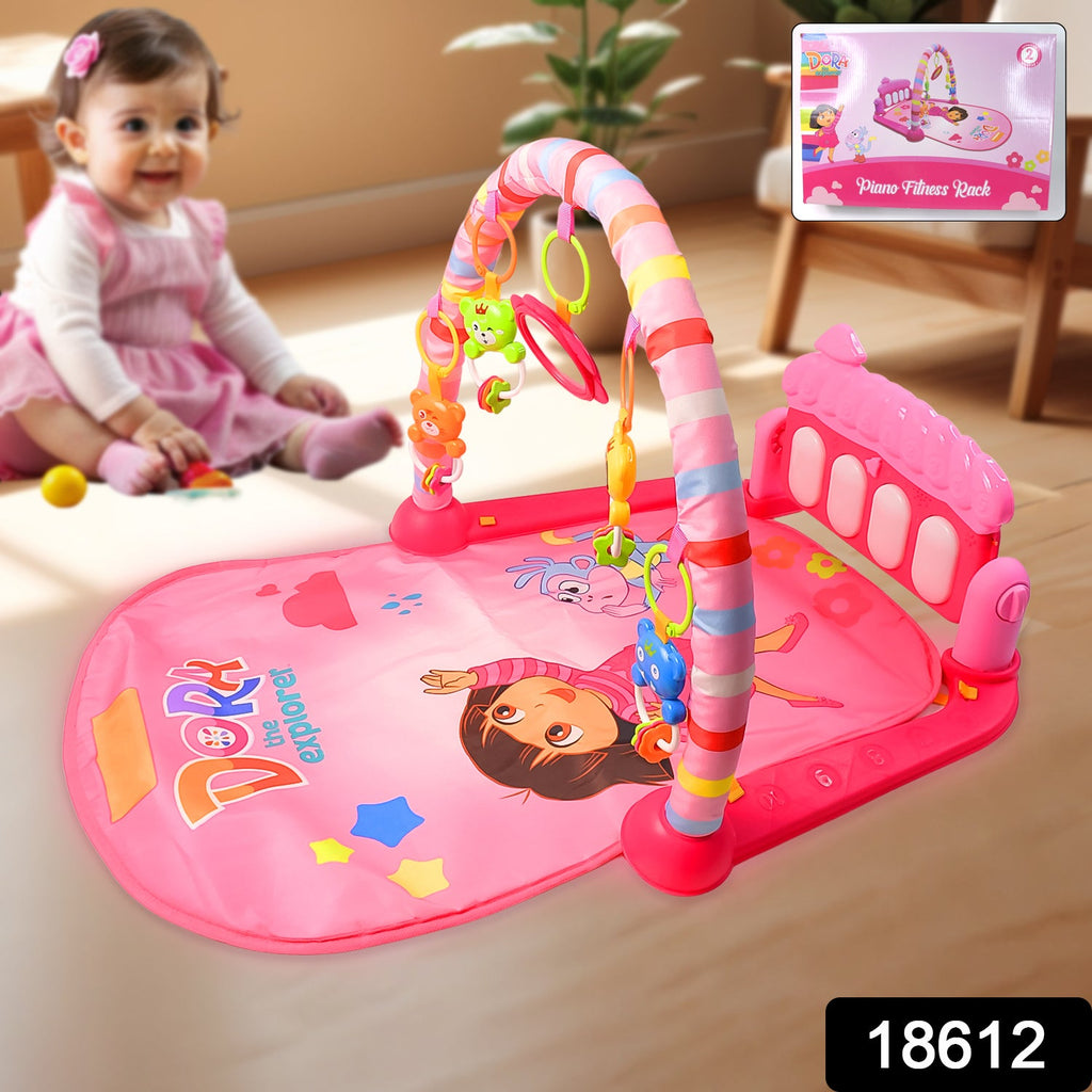 Infant kicking the musical piano on the Aditi baby play gym mat.