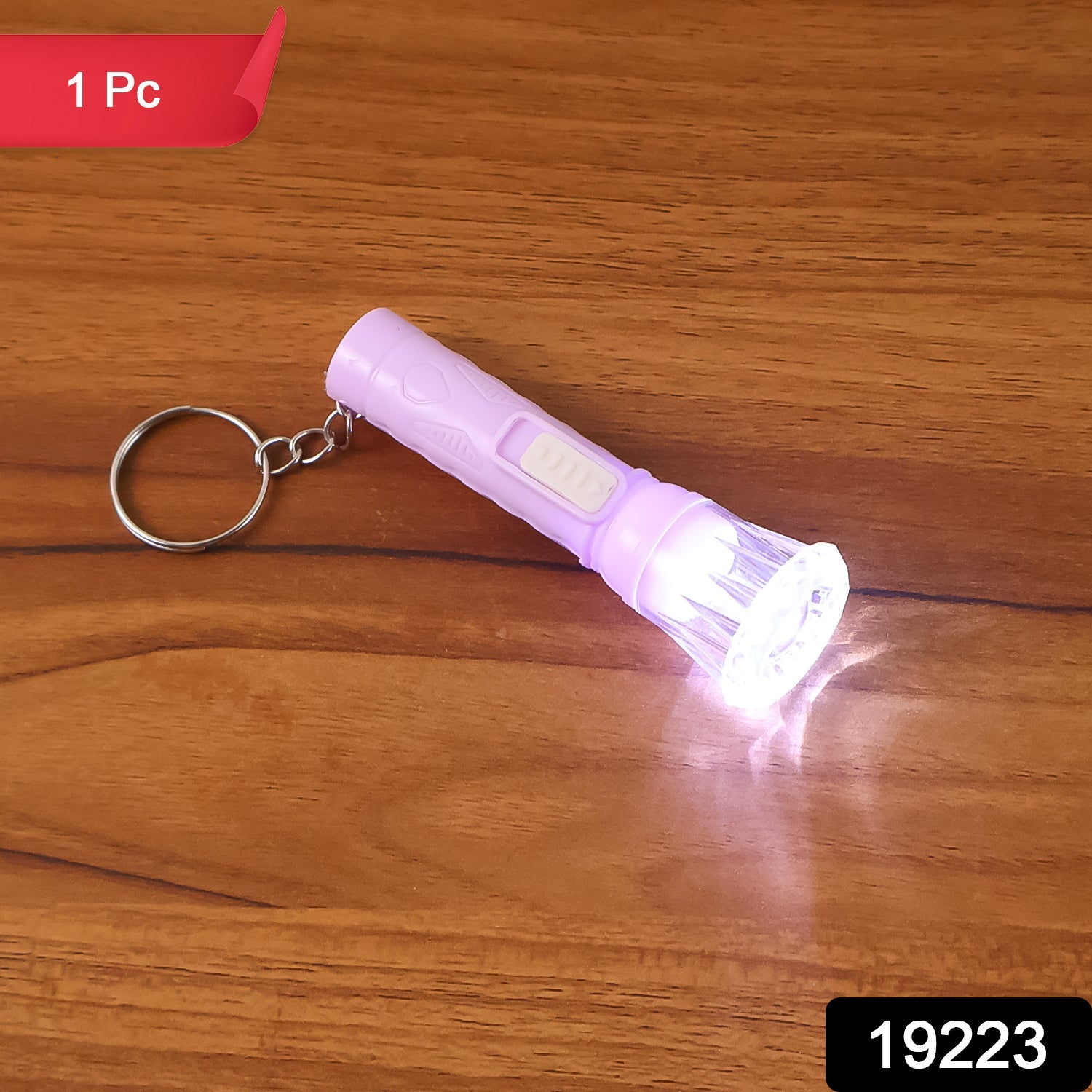 Compact LED torch attached to keyring for easy portability