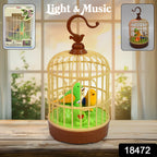 Close-up of the interactive chirping bird toy with flapping wings inside its cage.