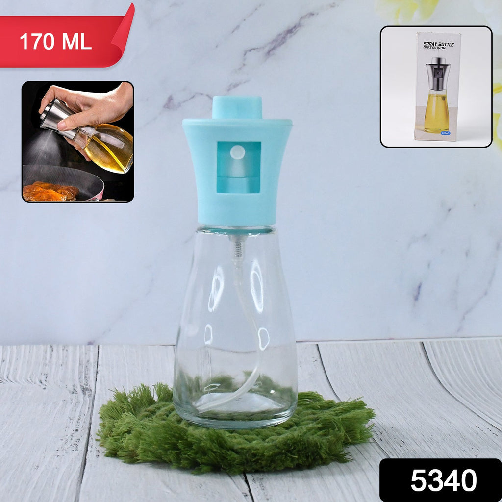 Oil sprayer dispenser filled with golden olive oil, ready for use in the kitchen.