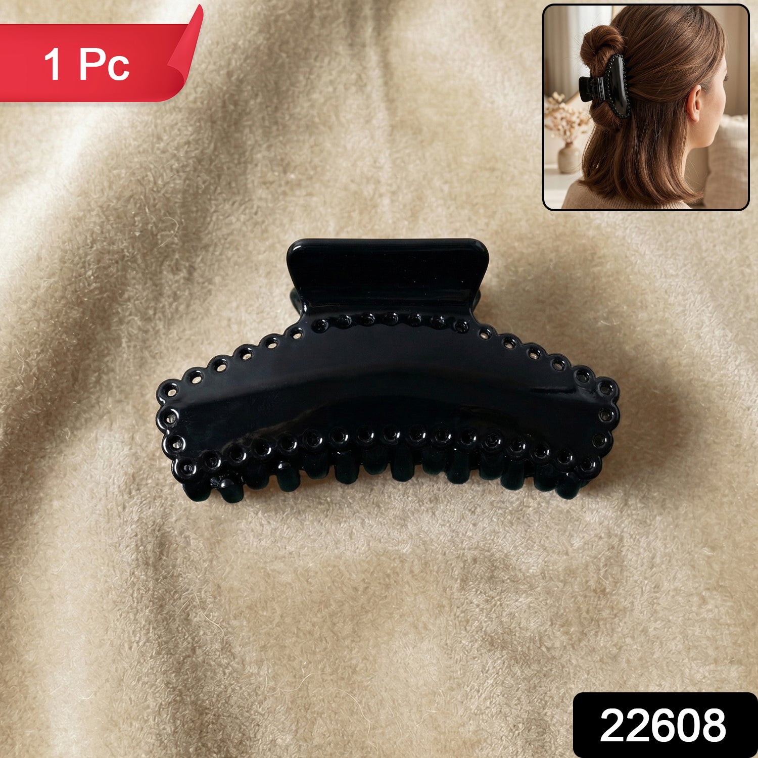 Black hair claw clip shown on a clean background, stylish and functional