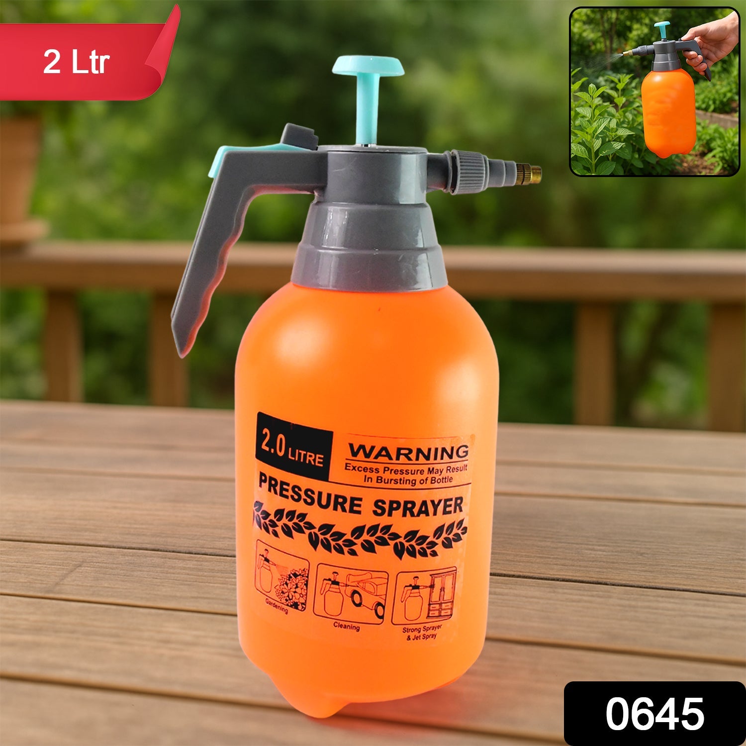 Person using a handheld garden sprayer to water outdoor plants.
