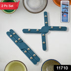 Close-up of folding pan stand for hot pots with anti-slip studs