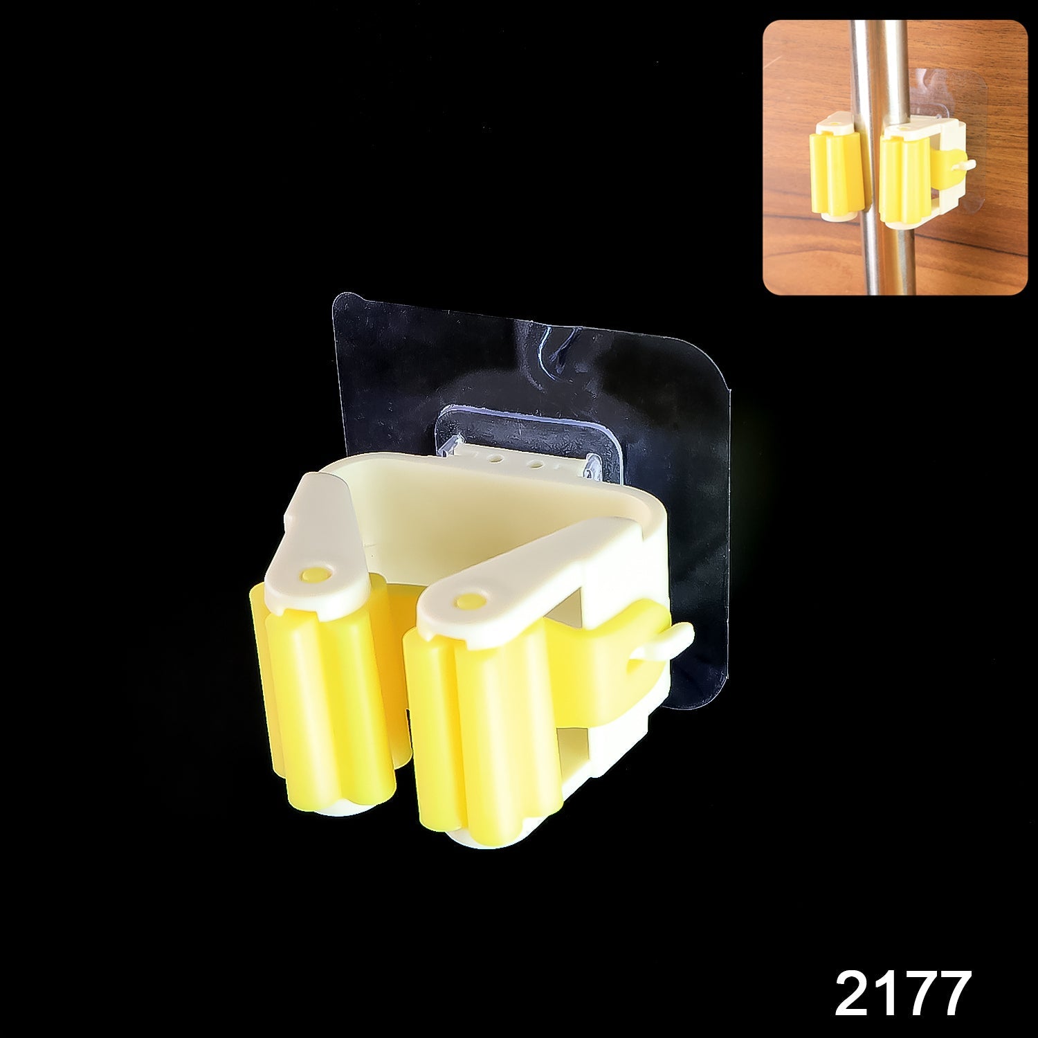 Kitchen wall with a self-adhesive mop holder neatly organizing a mop and broom.