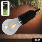 Portable LED camping lantern illuminating a tent at night.