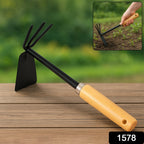 Detailed shot of the carbon steel head and ergonomic wooden handle of this gardening hoe.