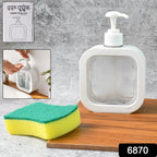 Refillable clear soap dispenser placed on a modern bathroom vanity with a faucet.