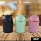 Cute mini dustbin placed on a wooden desk for office use