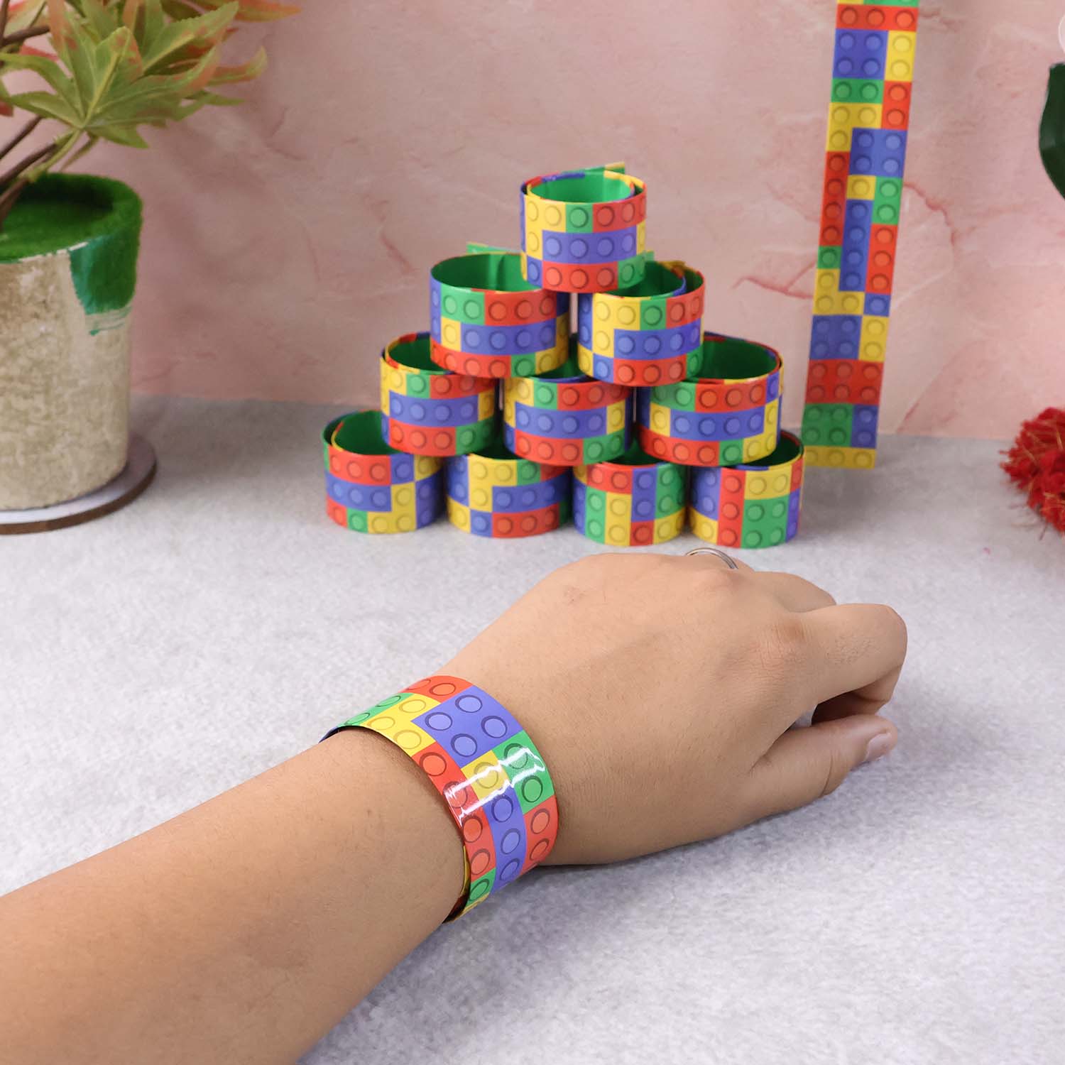 Various snap slap bracelets lined up with vibrant patterns