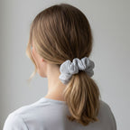 Close-up of hair tie made from dual-tone satin and mesh fabric