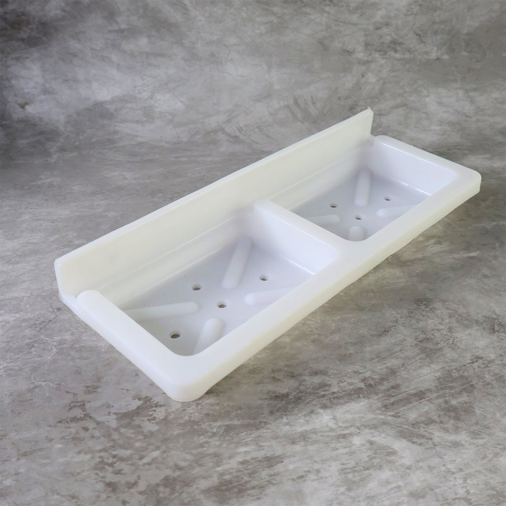 Wall mounted soap and sponge holder made from moisture-resistant plastic