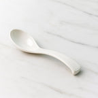 Plastic soup spoon used for noodles and broths