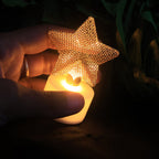 Flameless LED star candles arranged as a decorative centerpiece