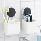 White plastic toothbrush holder storing small bathroom essentials
