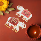 Elephant shaped Shubh Labh wall hangings showcasing intricate red and golden design