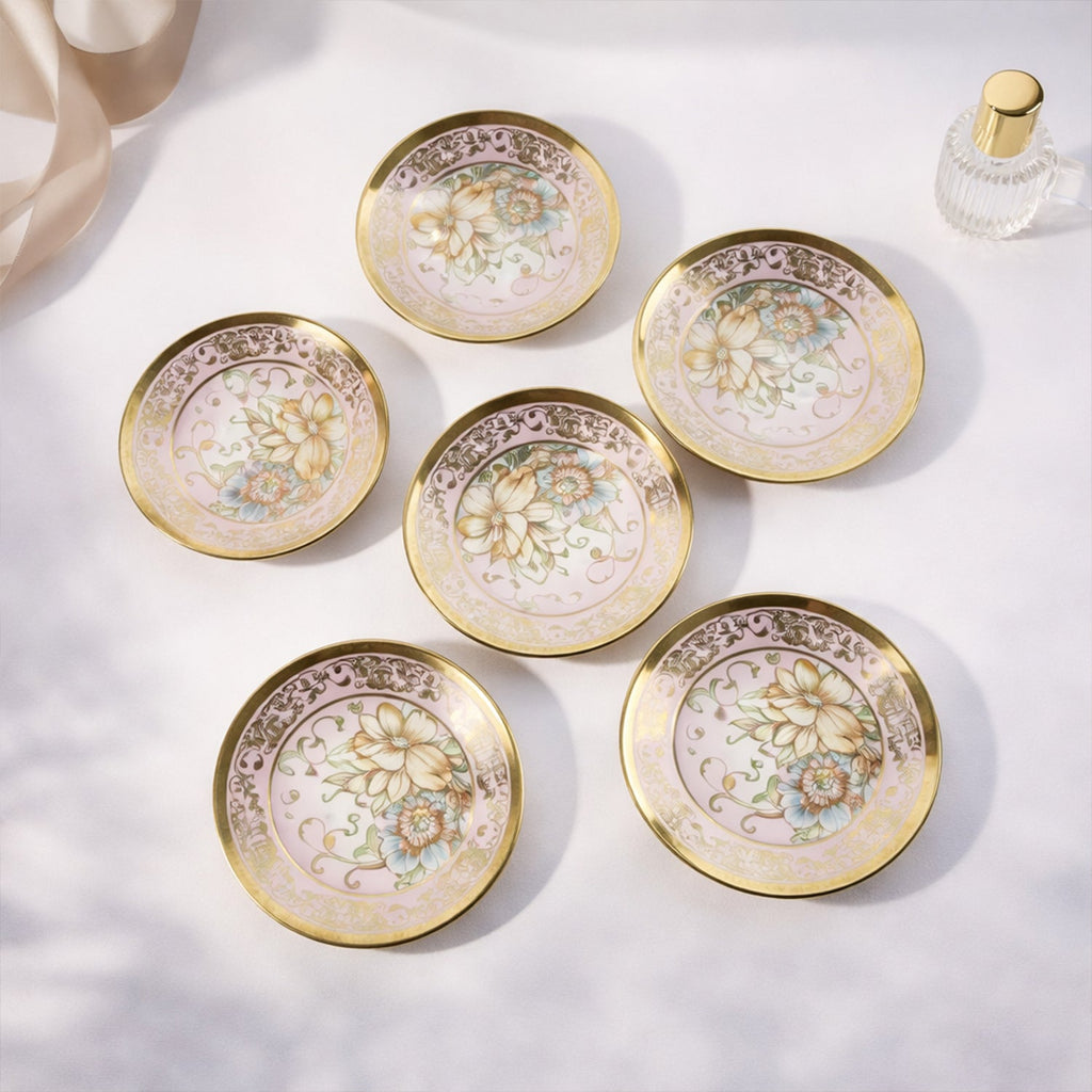 Matching porcelain tea cups with saucers in floral design