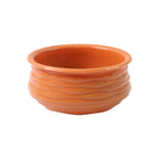 Side view of round terracotta-style serving bowl