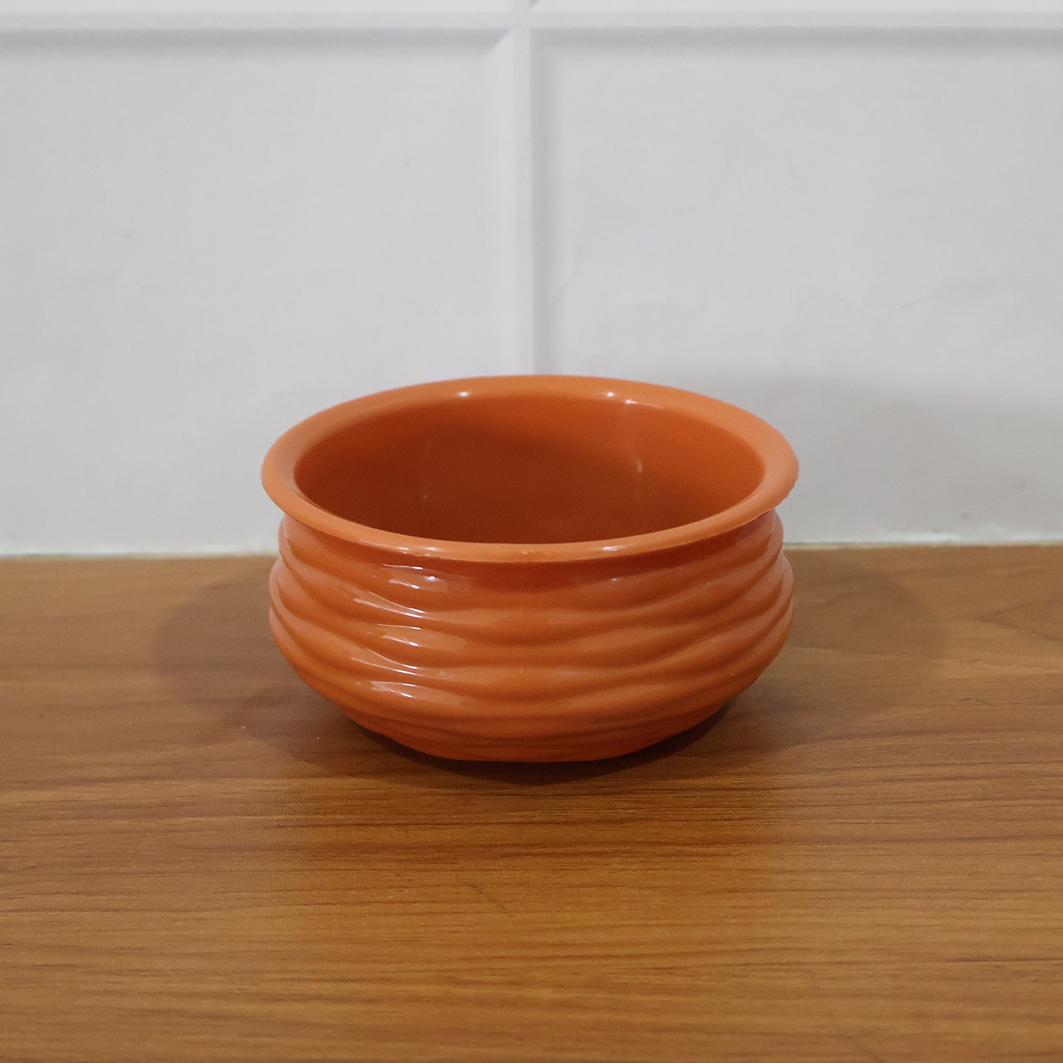 Terracotta serving bowl in a live kitchen setting