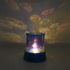 Close-up of the LED Projector Night Light projecting a colourful ocean wave effect on a wall.