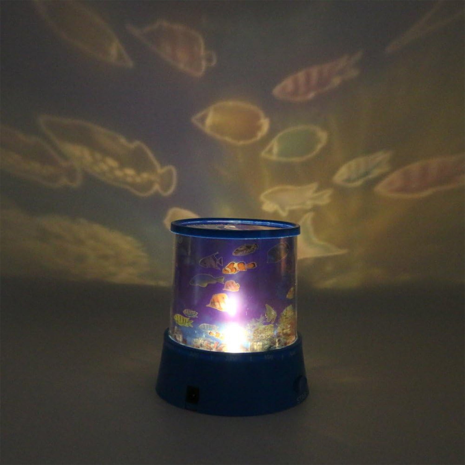 Close-up of the LED Projector Night Light projecting a colourful ocean wave effect on a wall.