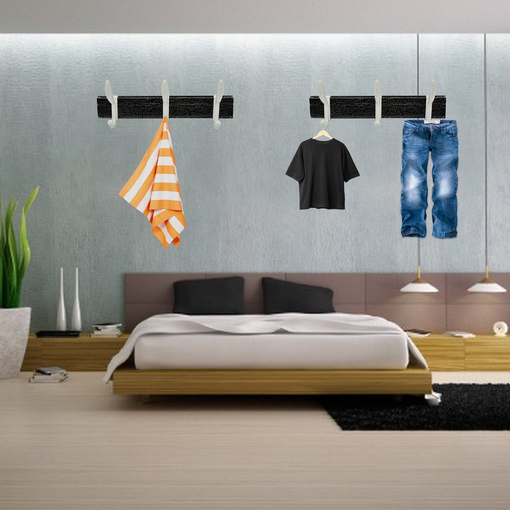 Usage example of the wall mounted coat rack in a home hallway holding various items