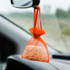 A collection of empty organza drawstring bags, ideal for bulk purchases for events.