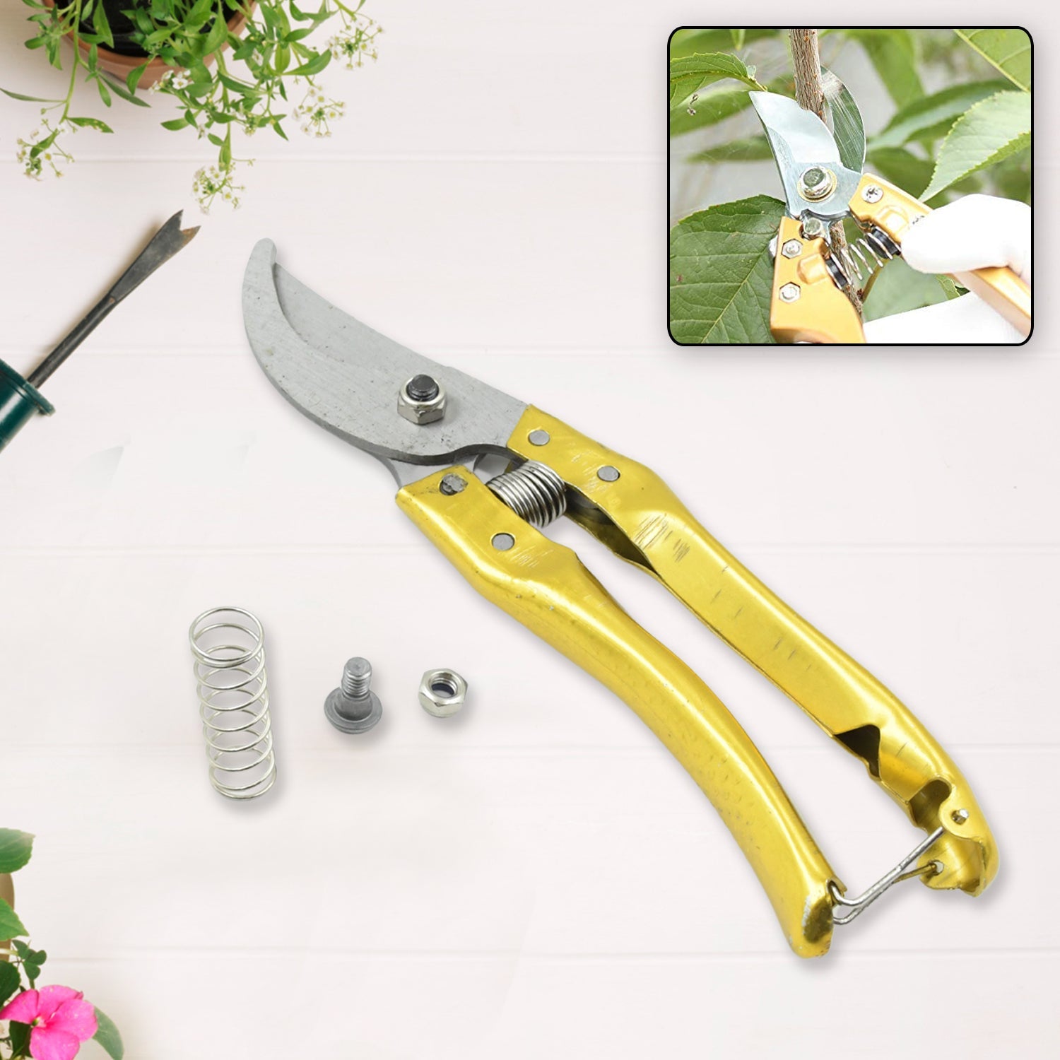 The garden shears stored safely in their plastic casing, highlighting convenient storage.