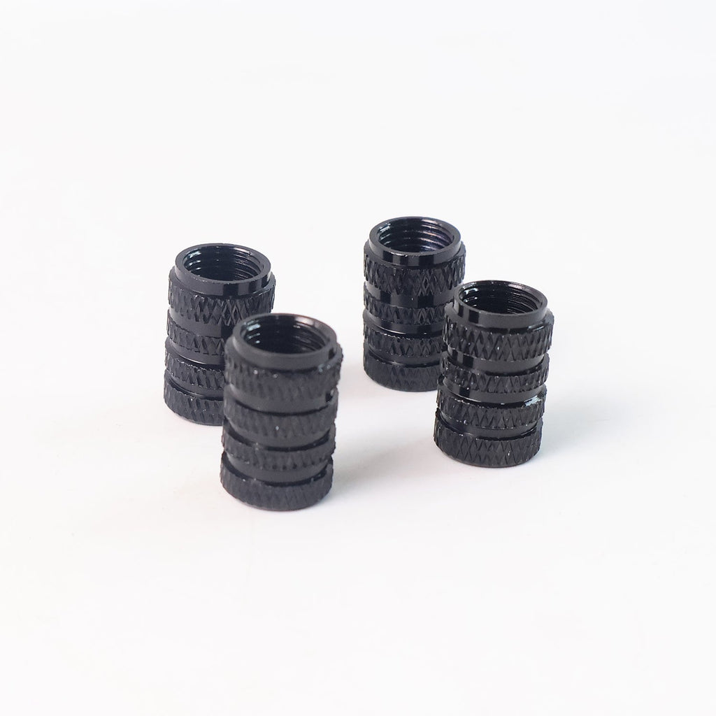 Single silver aluminium tire valve stem cap on clean white background