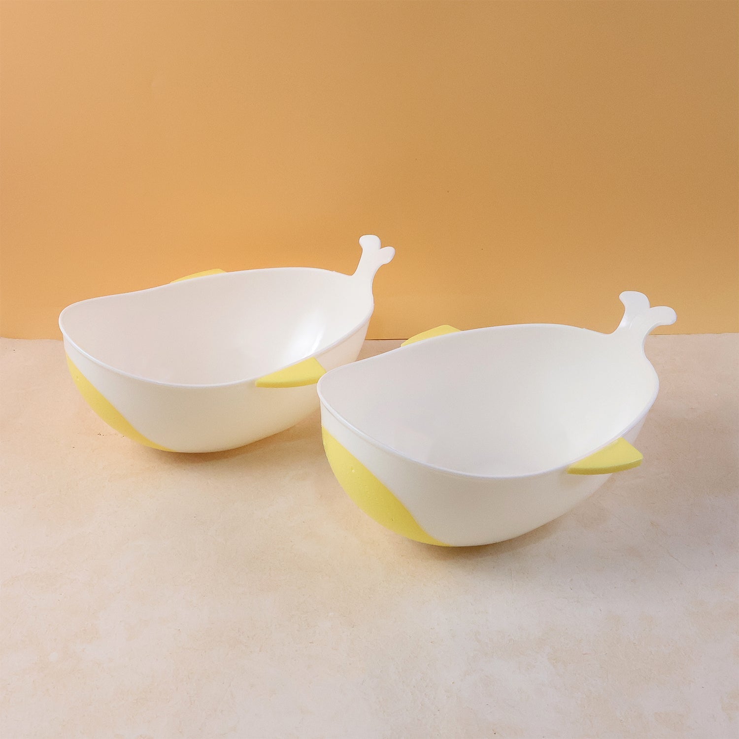 Two-piece plastic strainer and washing bowl for kitchen use