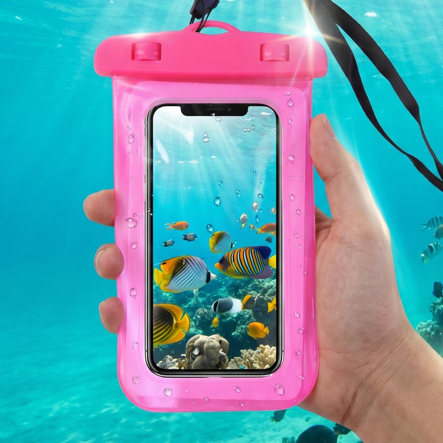 Angled view of pink waterproof mobile pouch cover in outdoor setting