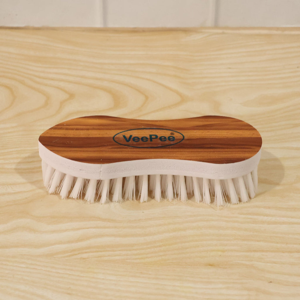 Close-up of cloth washing brush with nylon bristles and ergonomic grip