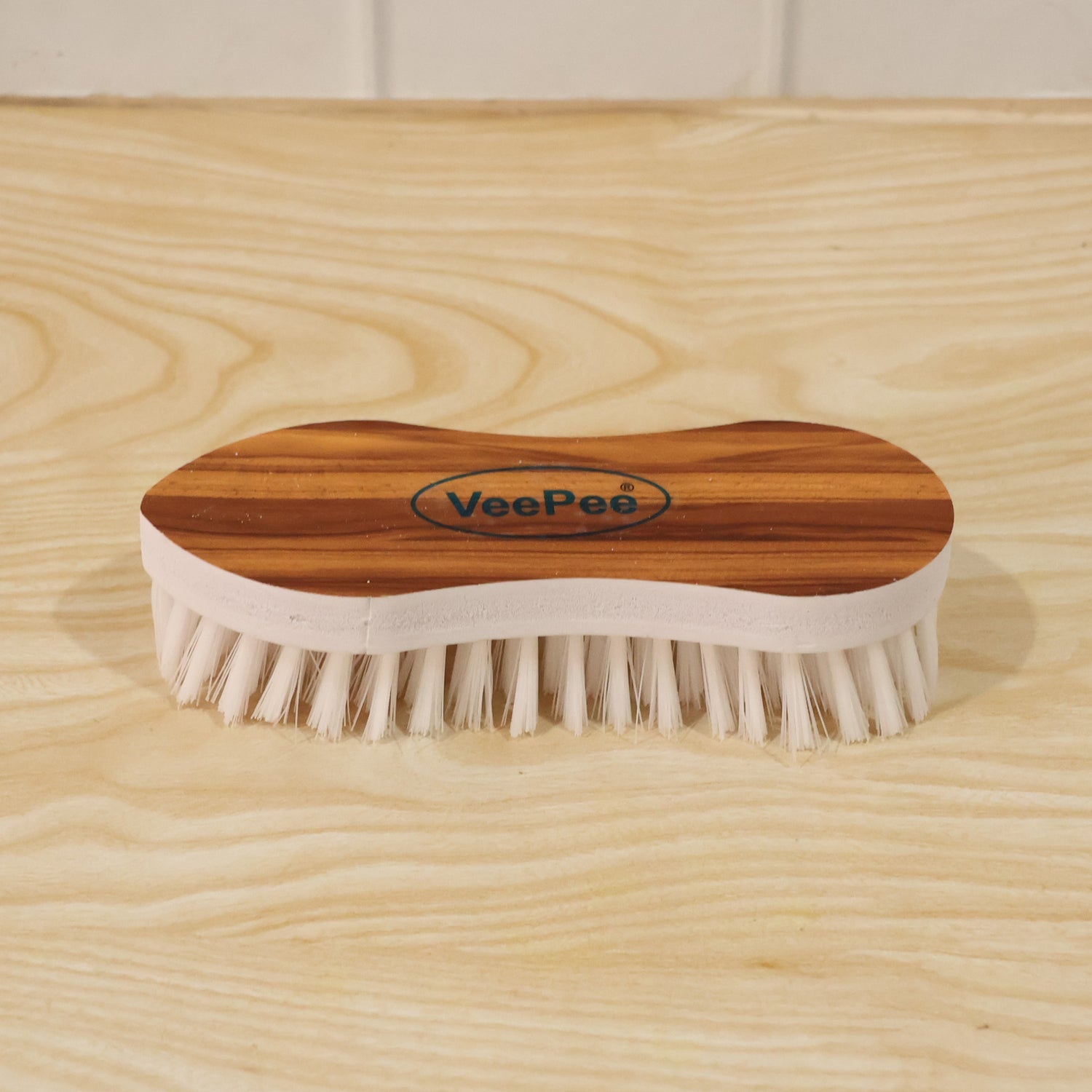 Close-up of cloth washing brush with nylon bristles and ergonomic grip