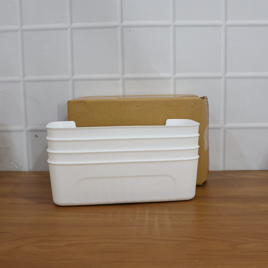 White plastic storage baskets displayed for home organization
