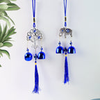 Evil eye metal wind chime hanging in balcony space for feng shui