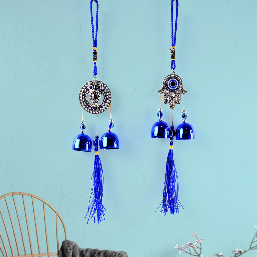 Multiple metal bells on evil eye wind chime creating soothing sounds