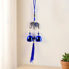 Metal evil eye wind chime hanging in home garden for protection and decor