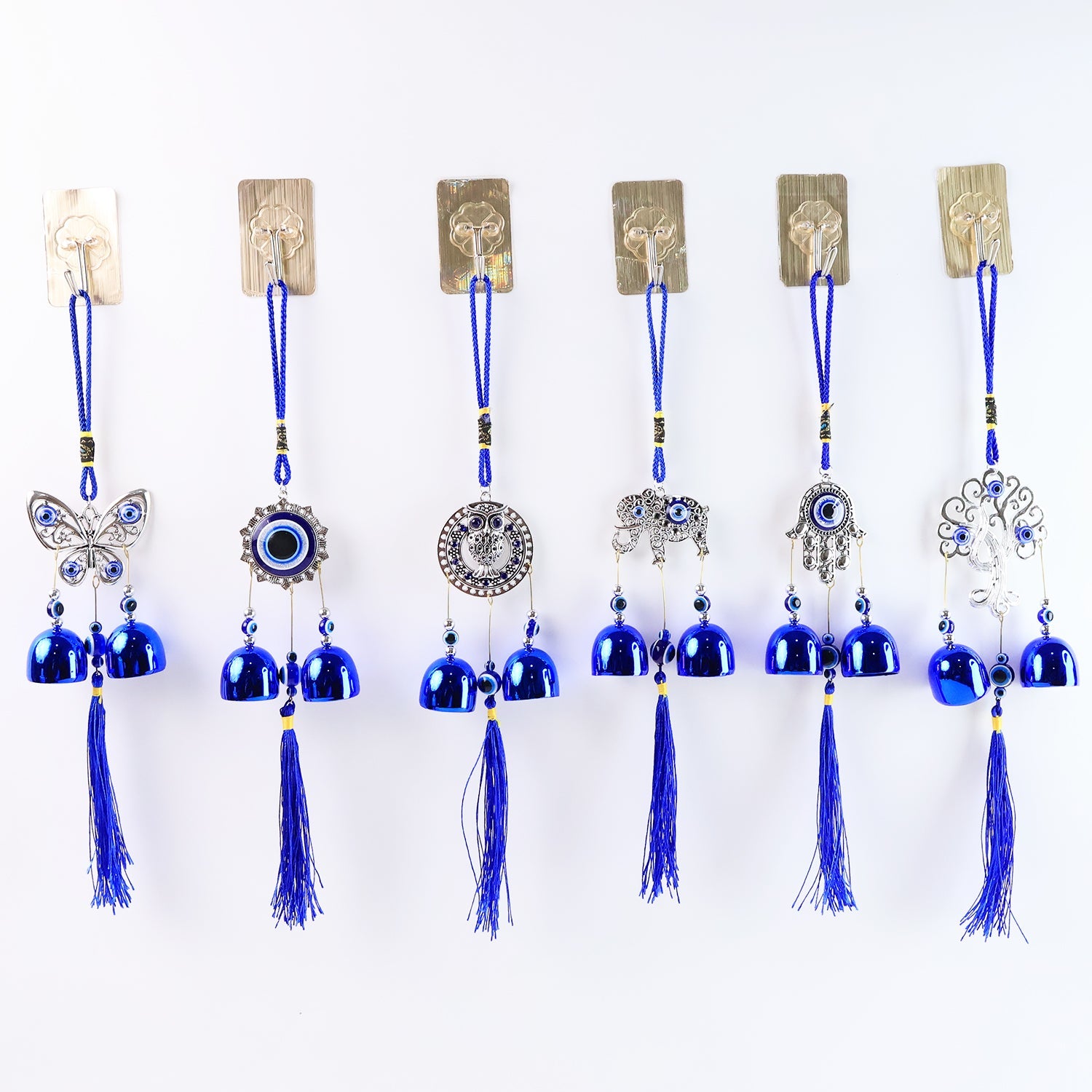 Detailed view of evil eye metal bell wind chime for house protection