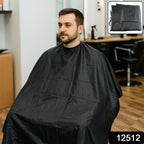 Salon apron cape showing full coverage during hair cutting