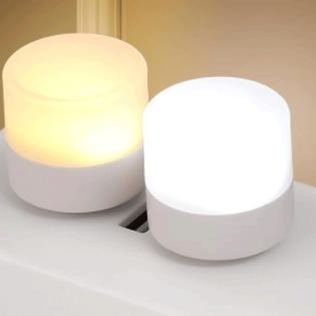 Yellow USB LED night light highlighting its small size and plug design