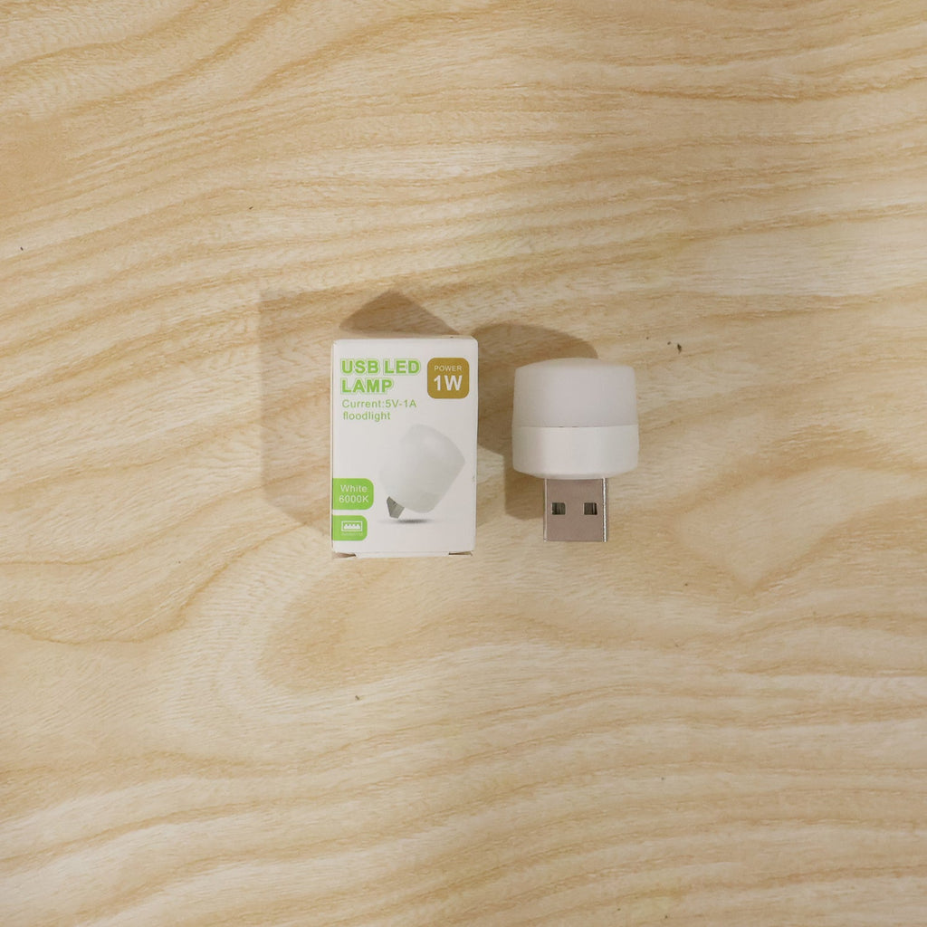 USB LED night light shining warm glow in a dark room
